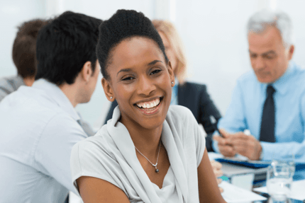 smiling-employee-meeting-570x381