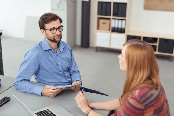 A young manager conducting a performance review with an employee A young manager conducting a performance review with an employee