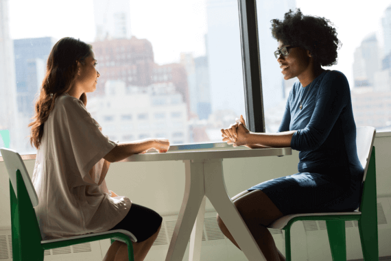 An informal business coaching chat at work