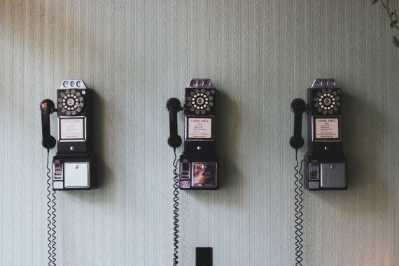 Old pay telephones mounted on a wall