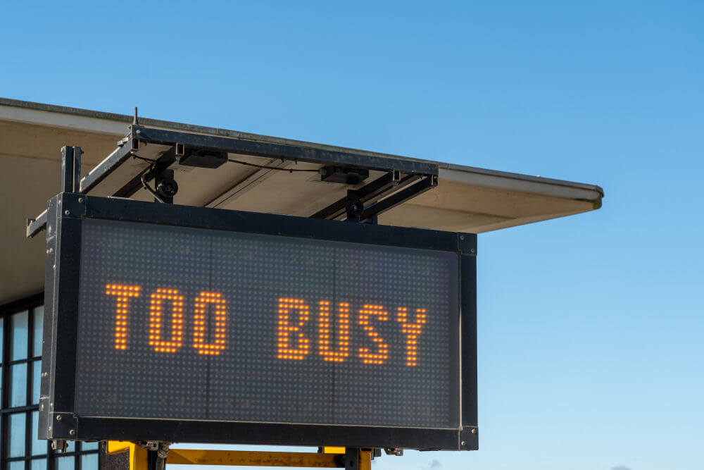 A road information sign saying Too Busy