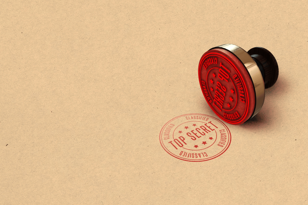 A top secret stamp in red ink signifying confidentiality