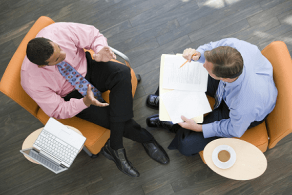 Two businessmen engaged in executive coaching