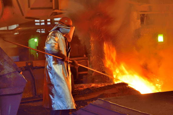 A worker in an iron foundry extremely hot environment