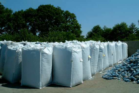 Waste material sorted in bags for recycling