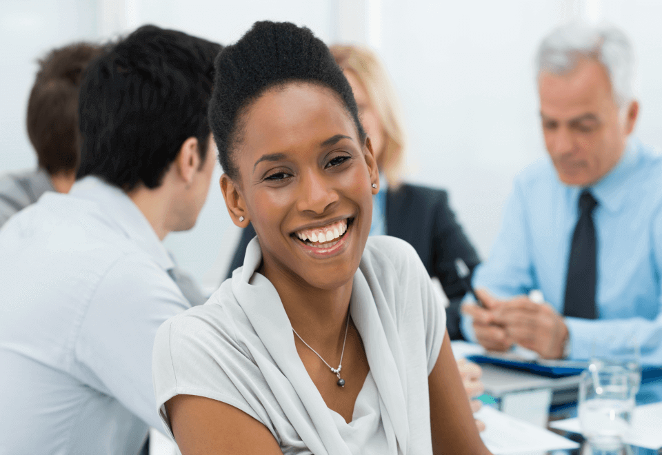 Smiling employee in a business meeting