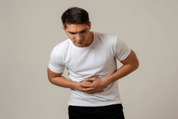 Young man with stomach discomfort