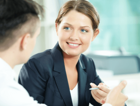 A young female manager receiving business coaching